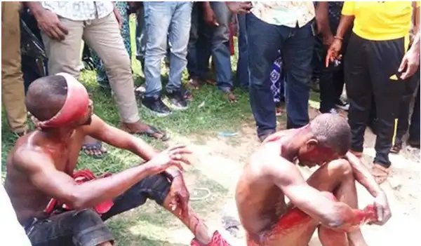 Angry Mob Descends On Young Men Suspected To Have Stolen A Car In Abuja [See Photo]